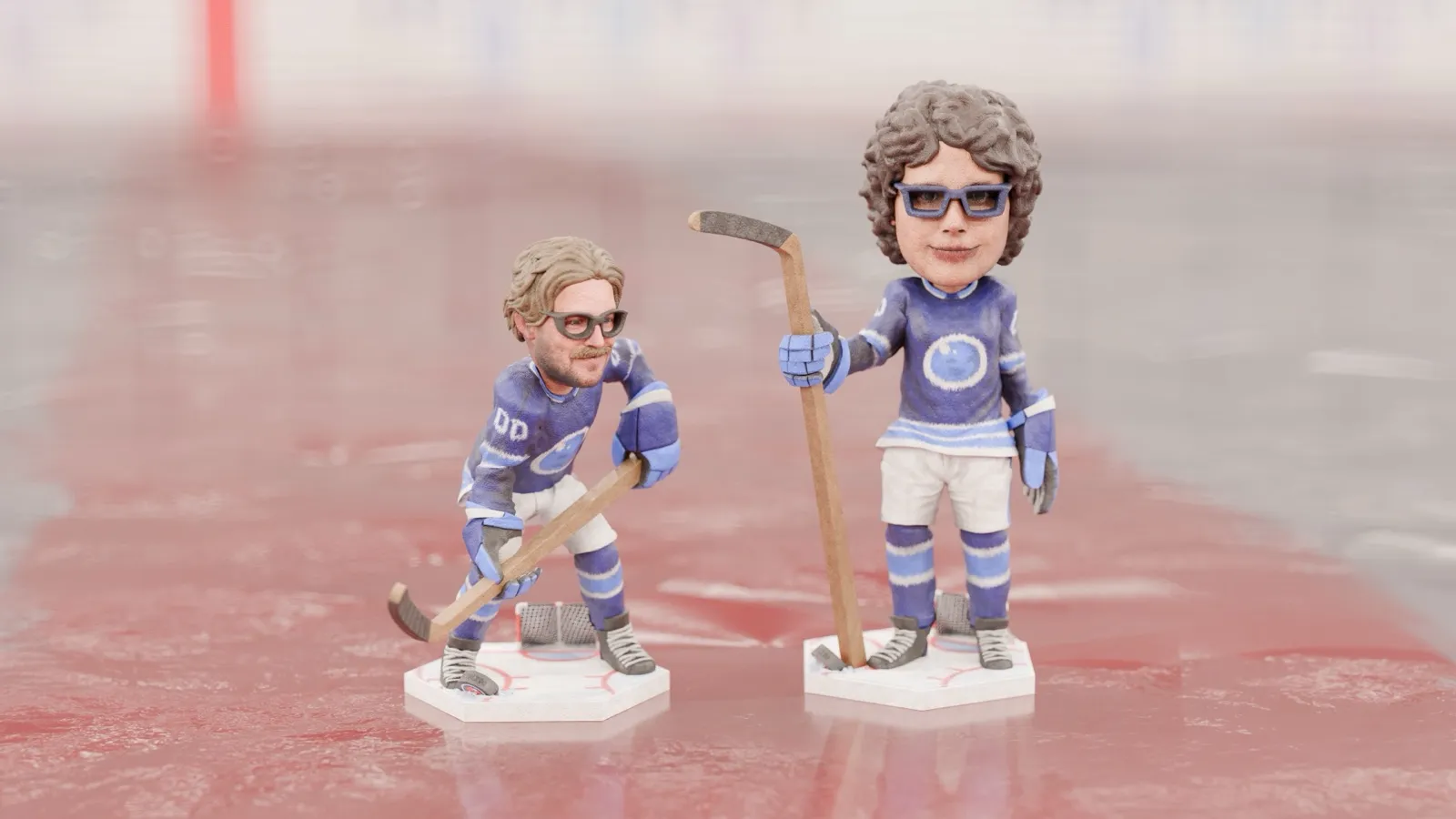 Two Minikin hockey-player bobbleheads with sticks, standing on the ice